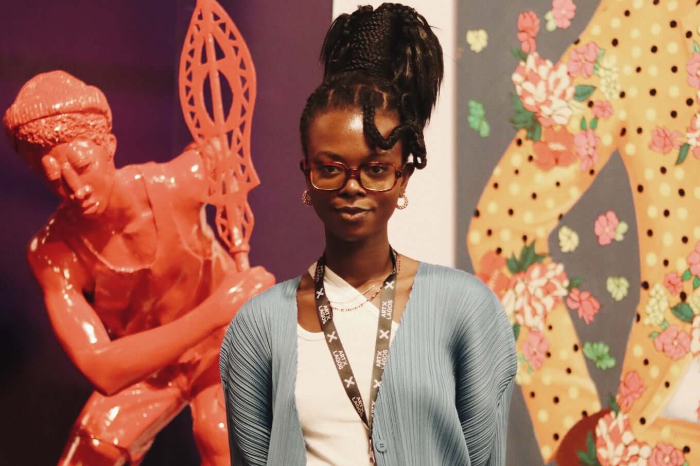 Artist in front of an art piece