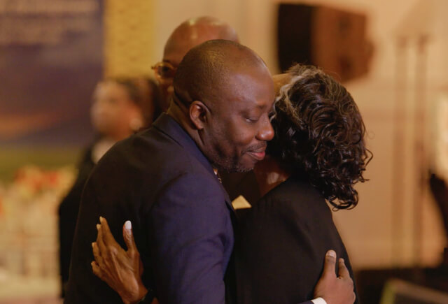 Two people greeting