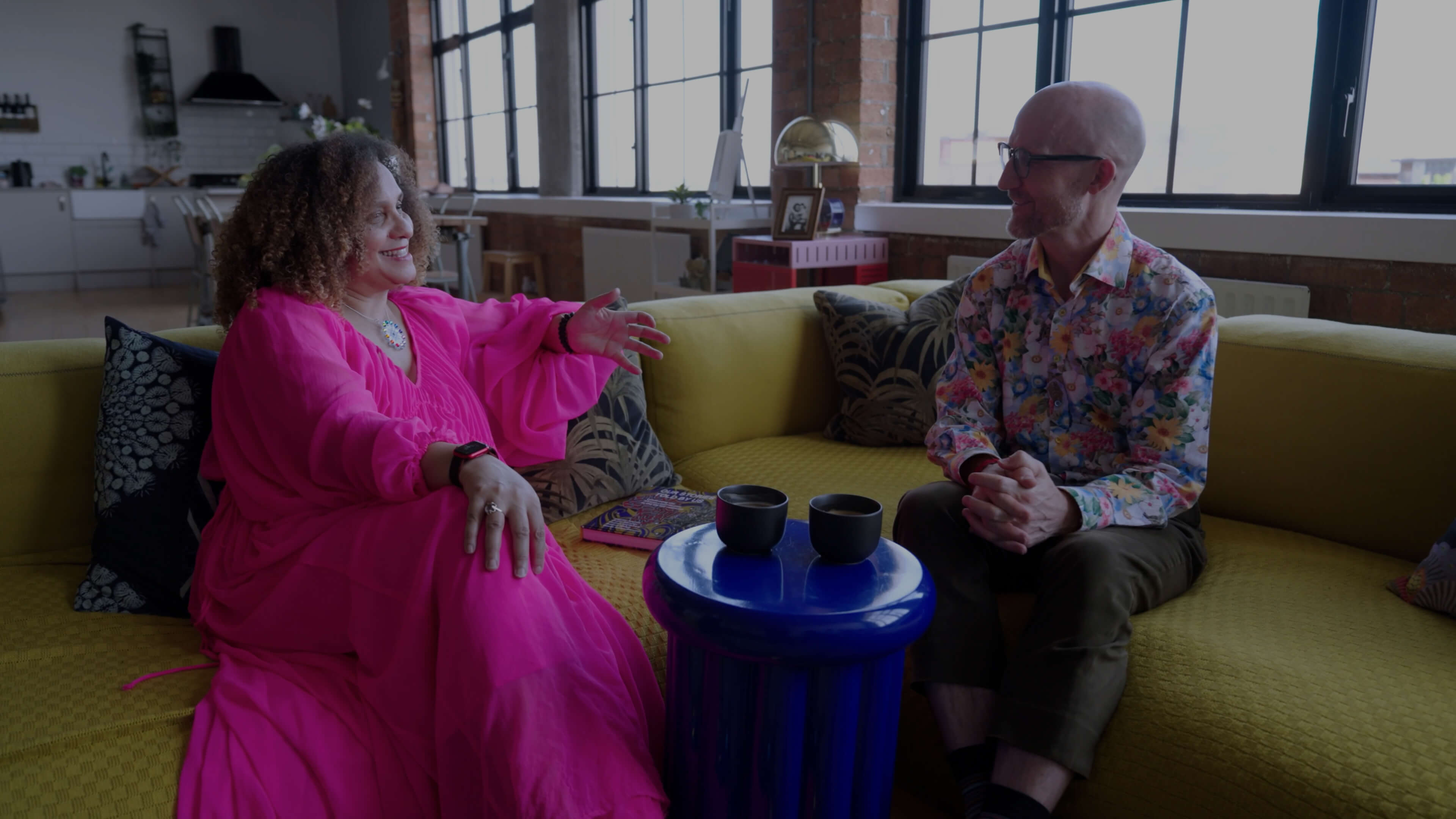 People talking on a sofa