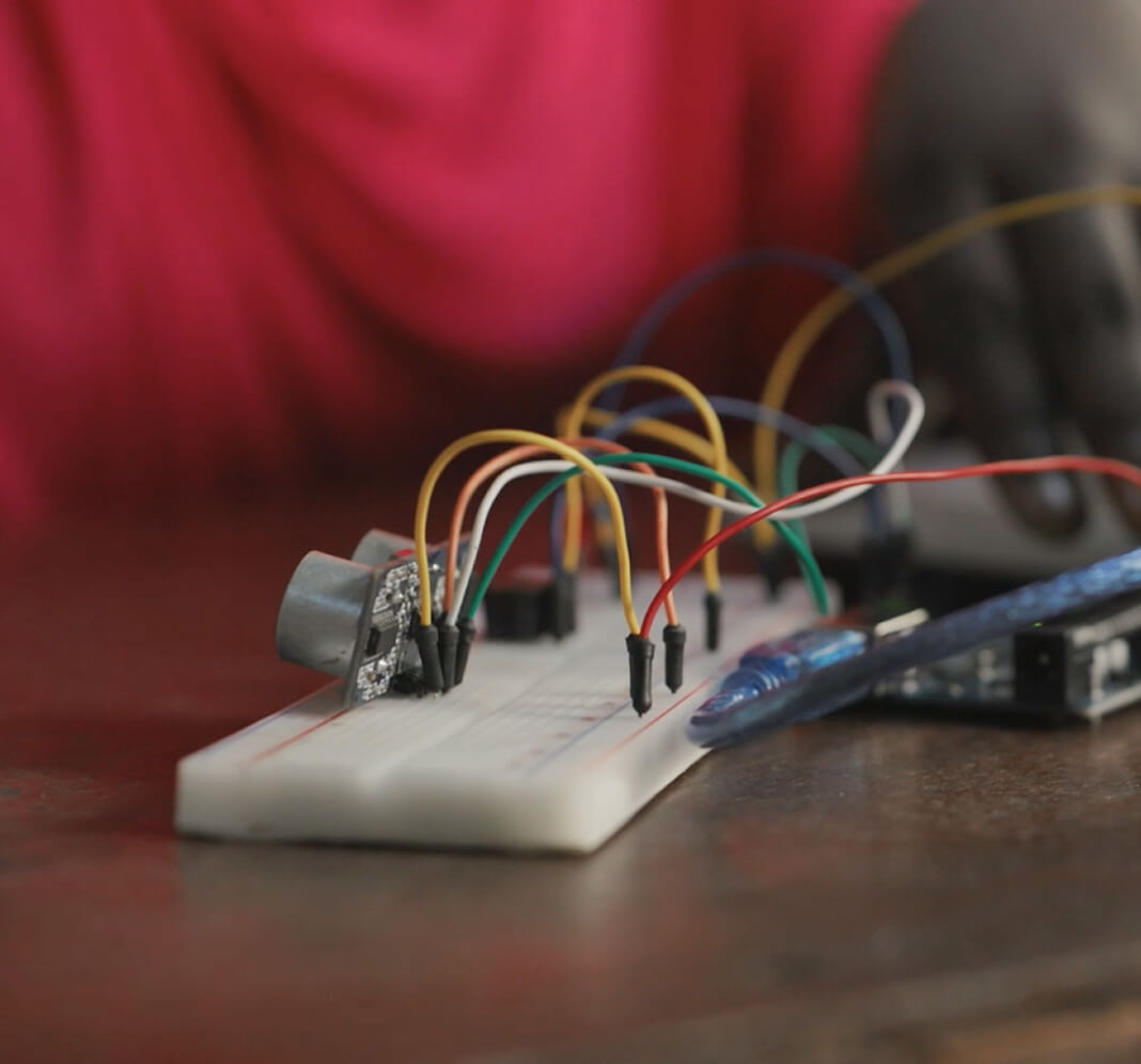 A student working with an electronics circuit